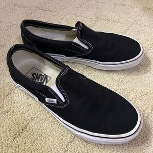 Black Vans slip-on shoes